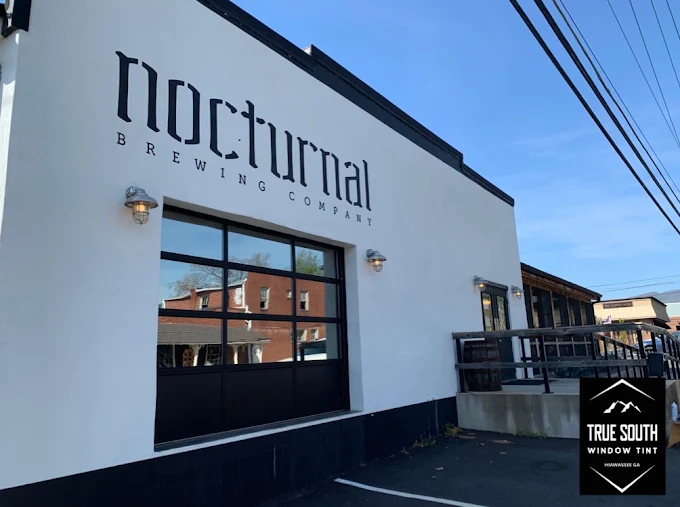 Tinted glass garage doors at Nocturnal Brewing Company